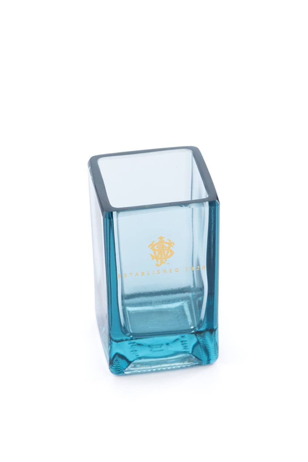 A square blue glass with a gold crest and Established 1820 lettering, seen from above on a white background